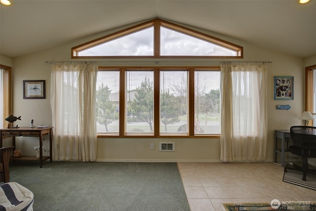 living room with a healthy amount of sunlight, visible vents, and lofted ceiling
