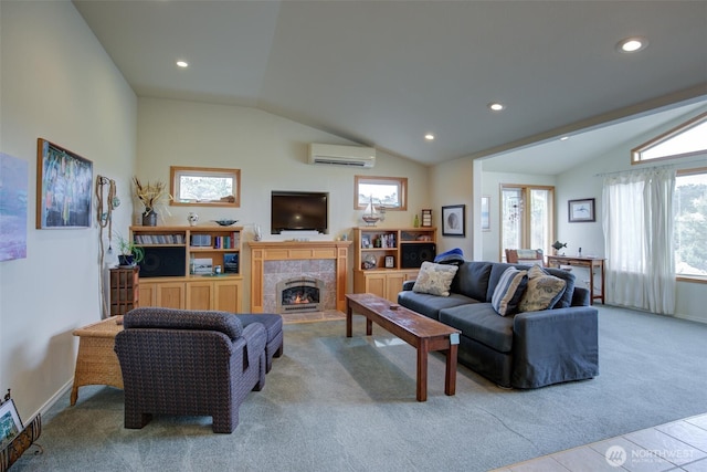 carpeted living area featuring a wall mounted AC, a tile fireplace, baseboards, lofted ceiling, and recessed lighting