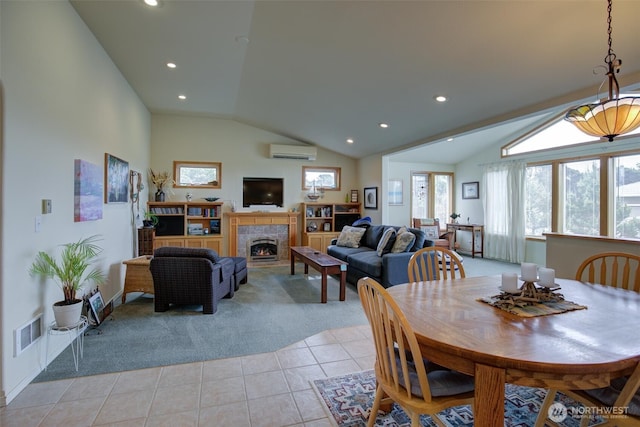 dining space with visible vents, a wall mounted AC, vaulted ceiling, and light colored carpet