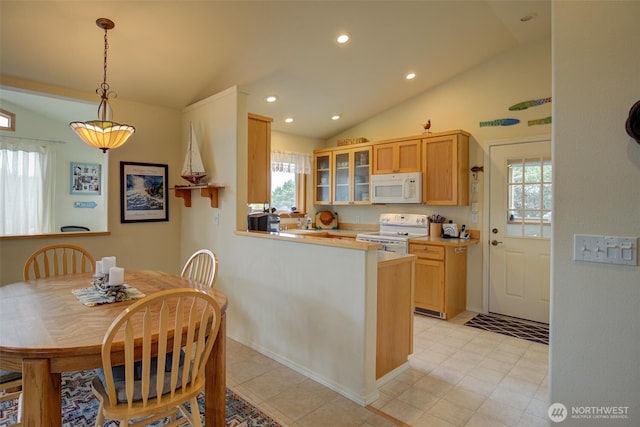 kitchen with white appliances, recessed lighting, decorative light fixtures, vaulted ceiling, and glass insert cabinets