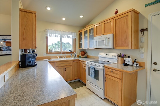 kitchen with a sink, a wood stove, white appliances, light countertops, and glass insert cabinets