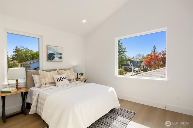8116 12th Ave SW Unit B, Seattle, WA 98106 - bedroom with lofted ceiling, wood finished floors, and recessed lighting