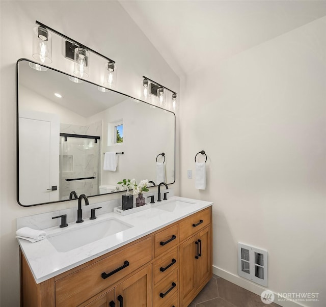 8116 12th Ave SW Unit B, Seattle, WA 98106 - full bathroom featuring double vanity, a shower stall, tile patterned flooring, and lofted ceiling
