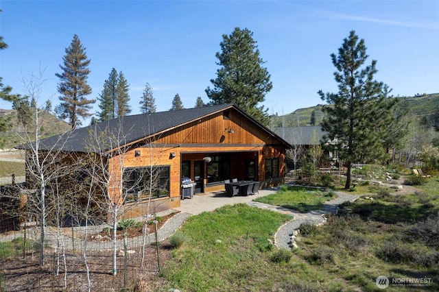 back of property featuring a patio