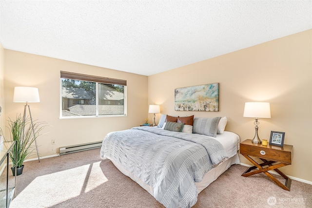 carpeted bedroom with a baseboard radiator, baseboards, and a textured ceiling