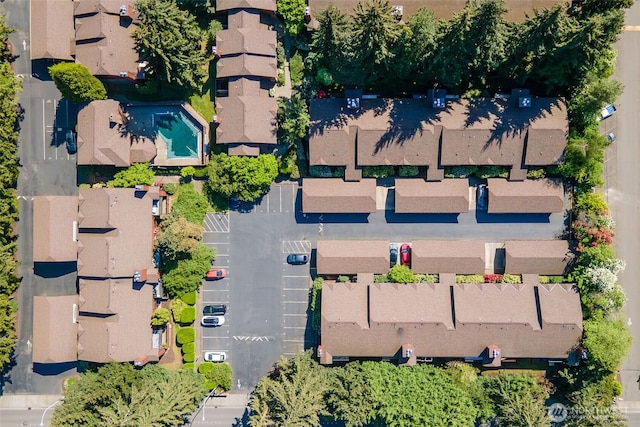 aerial view of property and surrounding area with nearby suburban area