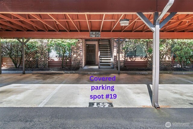 15617 NE 18th St Unit C203, Bellevue, WA 98008 - view of exterior entry with covered parking and brick siding