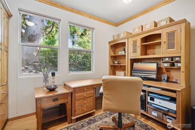 home office with light wood finished floors and baseboards