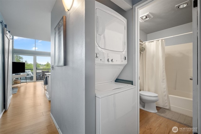 7806 Birch Bay Dr Unit 808, Blaine, WA 98230 - laundry area featuring stacked washer / dryer and light wood-style floors