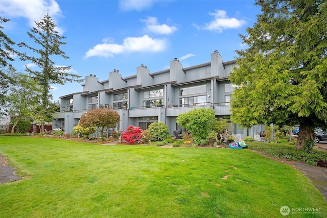 7806 Birch Bay Dr Unit 808, Blaine, WA 98230 - back of property featuring a yard, a balcony, and a chimney