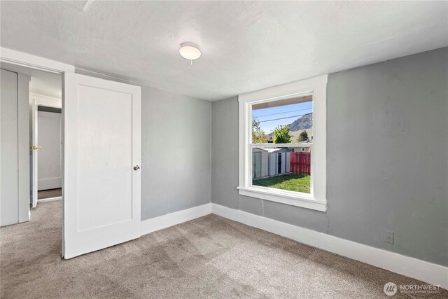 314 E Okanogan Ave, Chelan, WA 98816 - carpeted empty room featuring baseboards