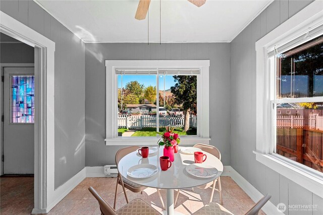 314 E Okanogan Ave, Chelan, WA 98816 - dining space featuring ceiling fan, baseboards, and ornamental molding