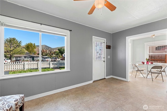 314 E Okanogan Ave, Chelan, WA 98816 - entryway featuring a mountain view, baseboards, and a ceiling fan