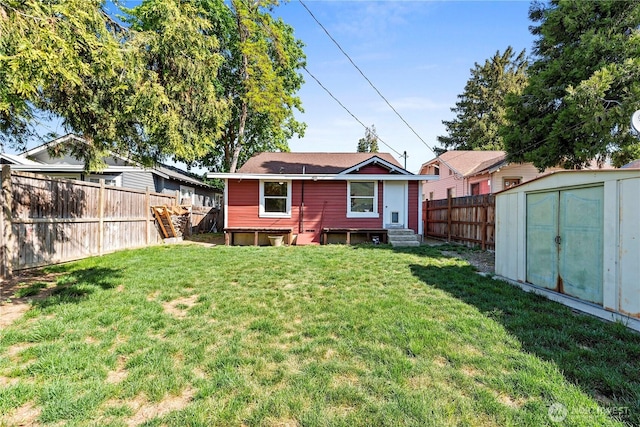 314 E Okanogan Ave, Chelan, WA 98816 - rear view of property with entry steps, an outdoor structure, and a shed