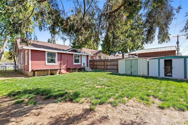 314 E Okanogan Ave, Chelan, WA 98816 - rear view of house with a storage unit, an outdoor structure, and entry steps