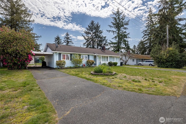 8803 Terrace Rd SW, Tacoma, WA 98498 - ranch-style house with a front lawn, asphalt driveway, a carport, and a chimney