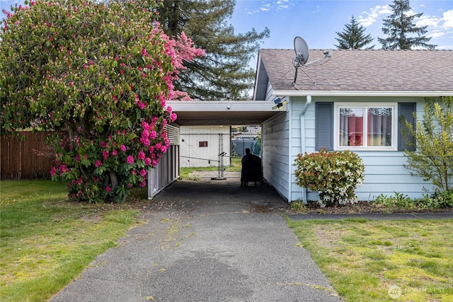 8803 Terrace Rd SW, Tacoma, WA 98498 - view of front of property featuring asphalt driveway, a carport, and a shingled roof