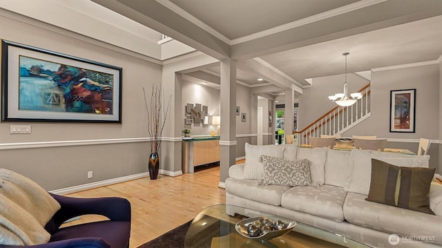 25413 NE 3rd Pl, Sammamish, WA 98074 - living area featuring light wood finished floors, baseboards, stairs, a chandelier, and crown molding