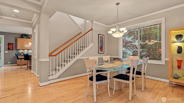 25413 NE 3rd Pl, Sammamish, WA 98074 - dining room with stairway, light wood finished floors, a chandelier, crown molding, and baseboards