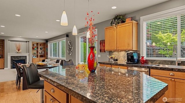 25413 NE 3rd Pl, Sammamish, WA 98074 - kitchen with a sink, open floor plan, light wood-style floors, recessed lighting, and a center island