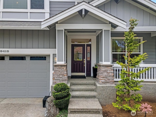 25413 NE 3rd Pl, Sammamish, WA 98074 - property entrance featuring board and batten siding, stone siding, and an attached garage
