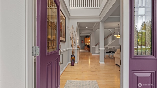 25413 NE 3rd Pl, Sammamish, WA 98074 - foyer entrance with stairs, light wood-style flooring, baseboards, and ornamental molding