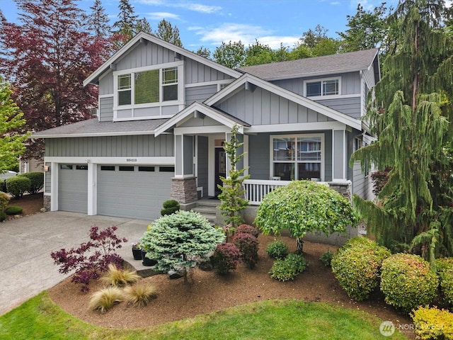 25413 NE 3rd Pl, Sammamish, WA 98074 - craftsman-style house featuring board and batten siding, a porch, a shingled roof, and a garage