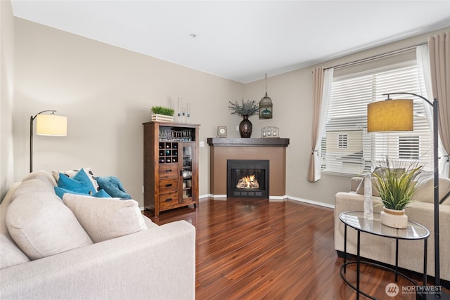 14519 1st Ln NE Unit 104, Duvall, WA 98019 - living area with wood finished floors, a glass covered fireplace, and baseboards