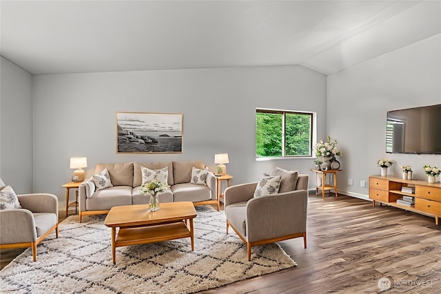 1027 Fishpond Rd, Kelso, WA 98626 - living area with wood finished floors, vaulted ceiling, and baseboards