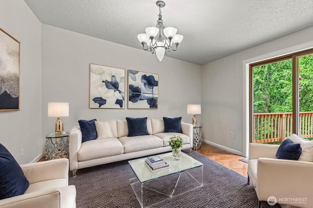 1027 Fishpond Rd, Kelso, WA 98626 - living area with a chandelier, a textured ceiling, and baseboards