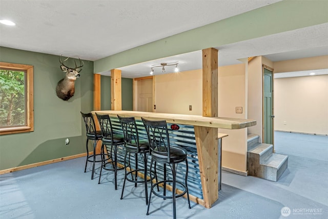 1027 Fishpond Rd, Kelso, WA 98626 - indoor dry bar featuring stairs and finished concrete floors
