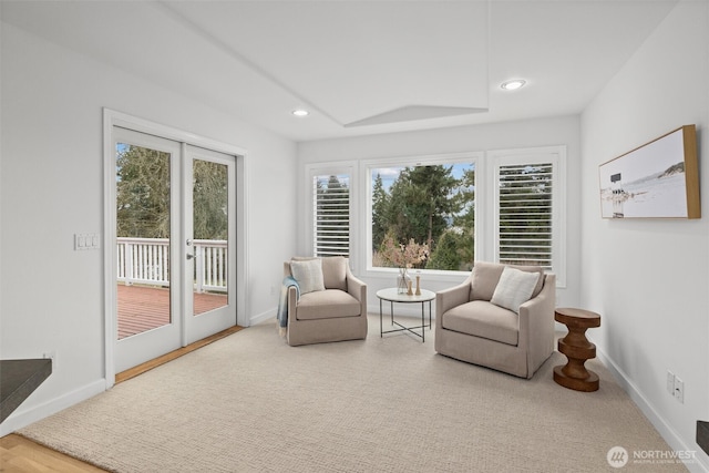 sitting room featuring recessed lighting, baseboards, and a healthy amount of sunlight