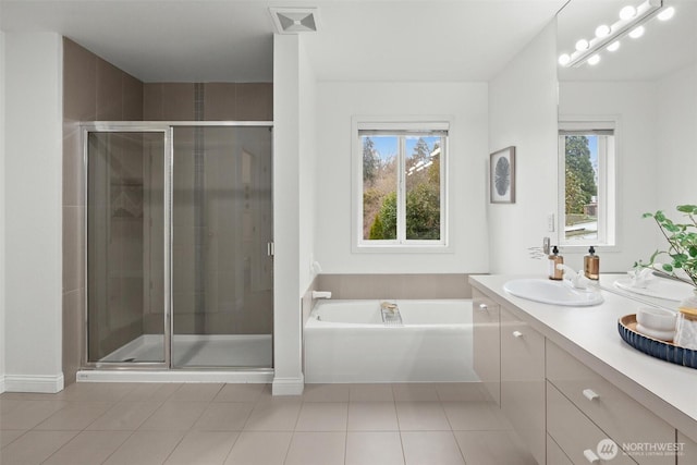 full bathroom with vanity, tile patterned floors, a shower stall, visible vents, and a bath