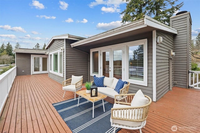 wooden deck with french doors and outdoor lounge area