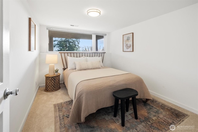 bedroom featuring baseboards, carpet flooring, and visible vents
