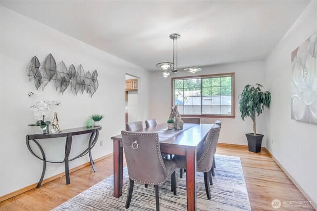 1742 N 122nd St, Seattle, WA 98133 - dining space with light wood-style floors and baseboards
