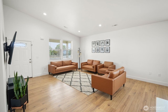 living room featuring light wood-style floors, recessed lighting, baseboards, lofted ceiling, and visible vents