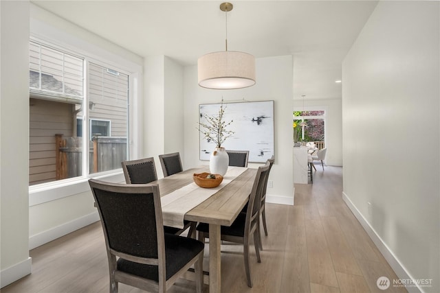 24858 NE 1st Pl, Sammamish, WA 98074 - dining area featuring light wood-style flooring and baseboards