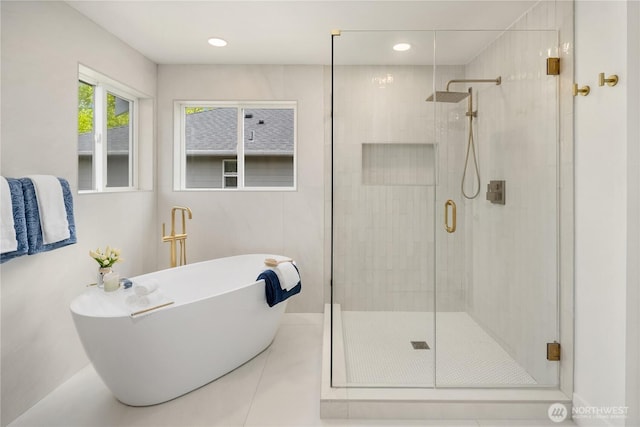 24858 NE 1st Pl, Sammamish, WA 98074 - bathroom featuring a stall shower, a soaking tub, recessed lighting, and tile patterned flooring