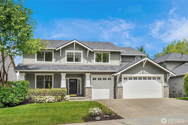 24858 NE 1st Pl, Sammamish, WA 98074 - view of front facade with a front lawn, concrete driveway, a shingled roof, stone siding, and an attached garage