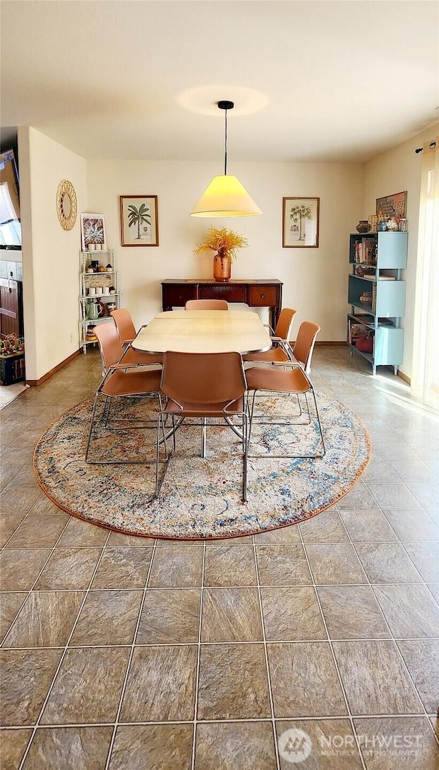 dining room featuring baseboards