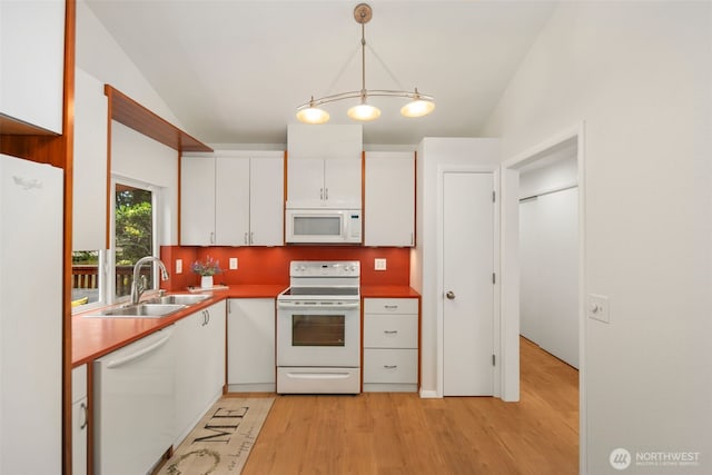 3131 110th St SE, Everett, WA 98208 - kitchen with white appliances, white cabinets, a sink, light wood-style flooring, and hanging light fixtures