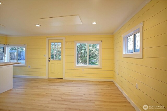 566 Sundin Dr, Camano Island, WA 98282 - entryway with light wood-style floors, wooden walls, and recessed lighting