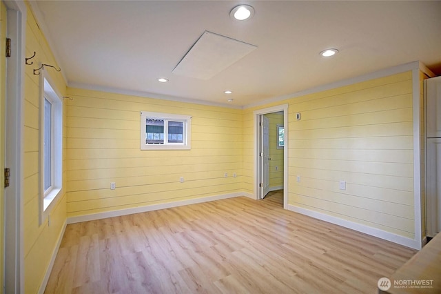 566 Sundin Dr, Camano Island, WA 98282 - spare room with baseboards, wood walls, light wood-style flooring, and recessed lighting