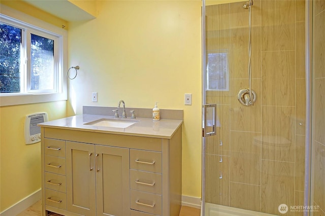 566 Sundin Dr, Camano Island, WA 98282 - full bath with heating unit, vanity, baseboards, and a stall shower