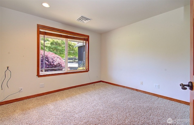 carpeted empty room featuring baseboards, recessed lighting, and visible vents