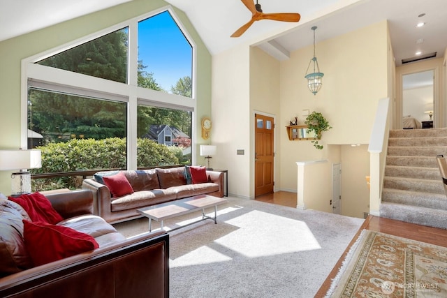 living room with a ceiling fan, high vaulted ceiling, stairway, and recessed lighting