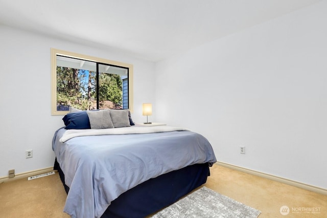 carpeted bedroom with baseboards