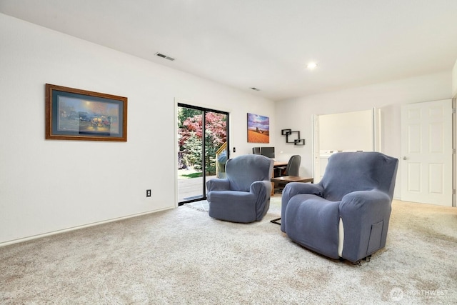 sitting room featuring carpet flooring and recessed lighting
