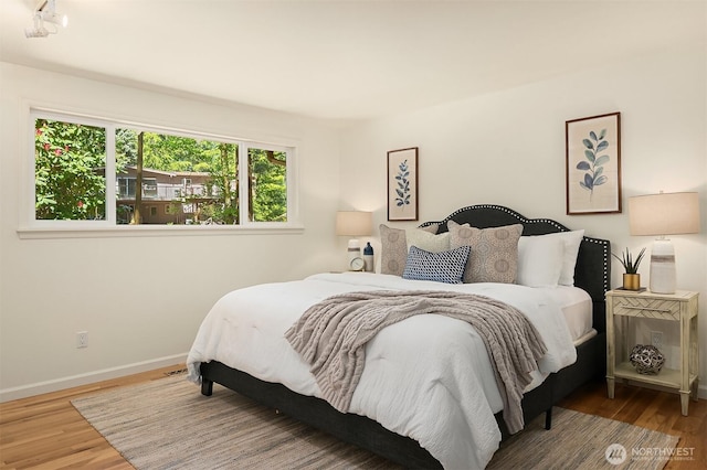 12802 NE 26th Pl, Bellevue, WA 98005 - bedroom featuring wood finished floors and baseboards
